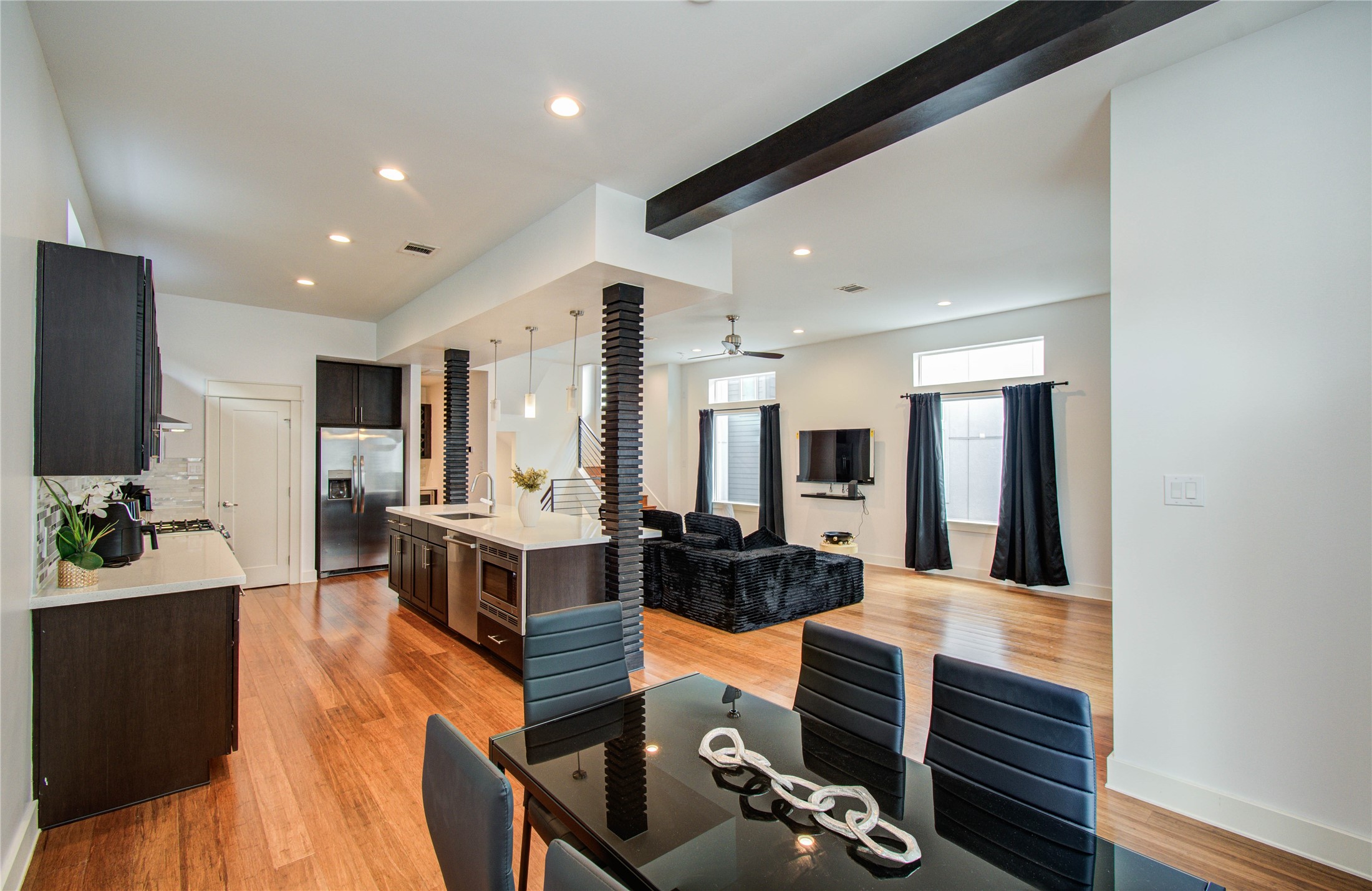 4311 Marina Street Houston, TX 77007 - Photo 18 of 42 a living room with furniture kitchen view and a large window