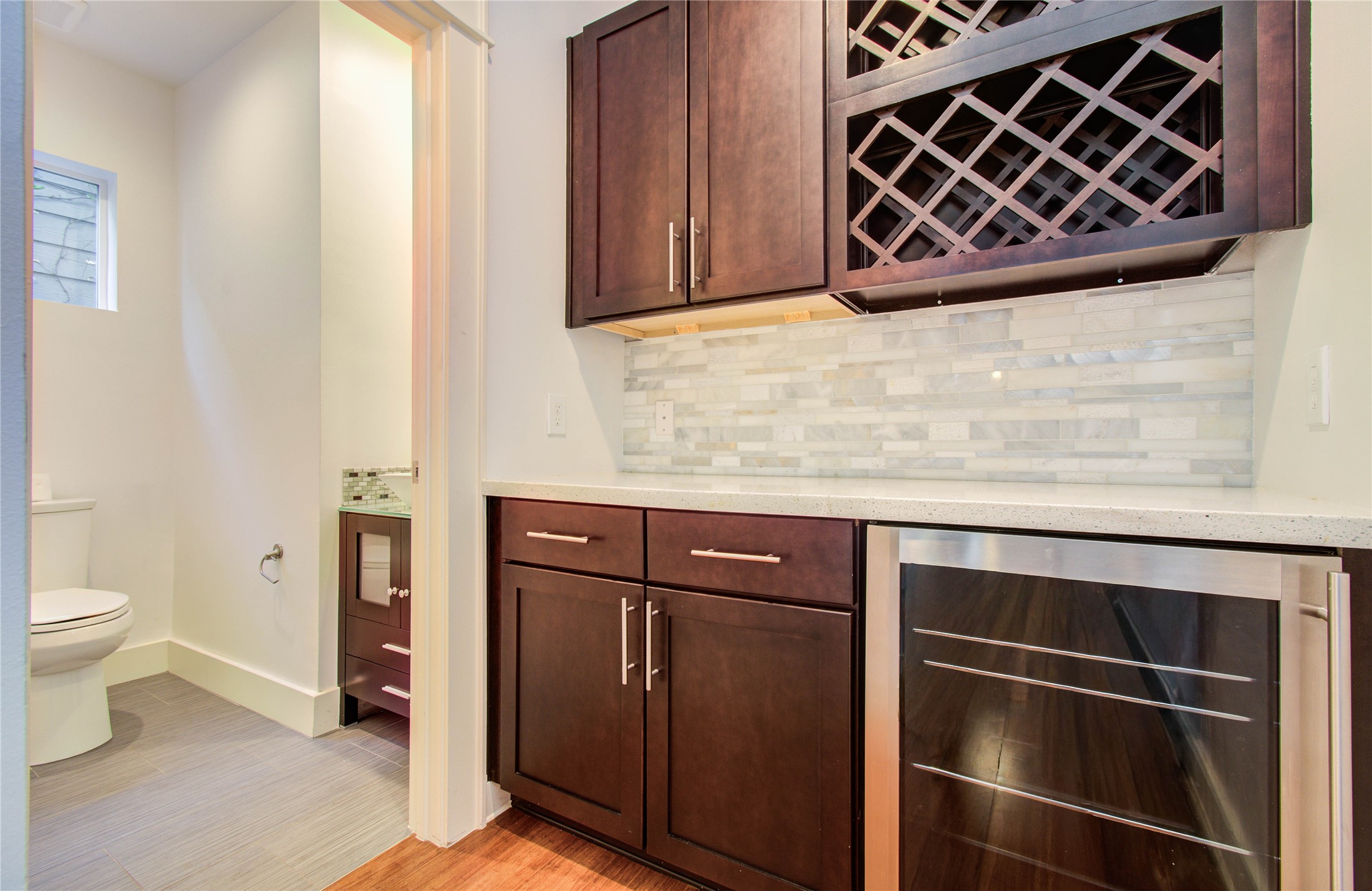 4311 Marina Street Houston, TX 77007 - Photo 24 of 42 a bathroom with a granite countertop sink and a toilet