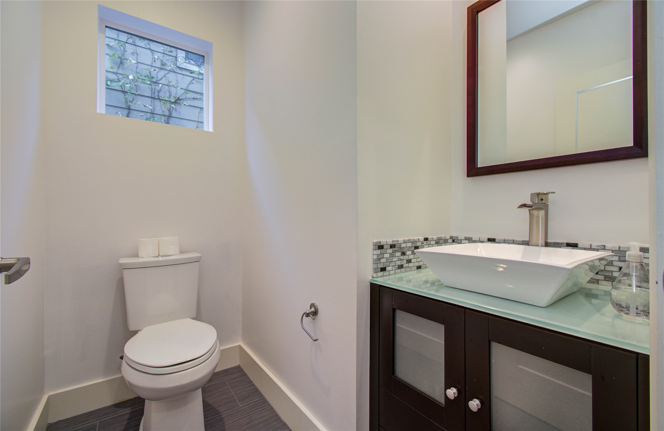 4311 Marina Street Houston, TX 77007 - Photo 25 of 42 a bathroom with a toilet sink and mirror