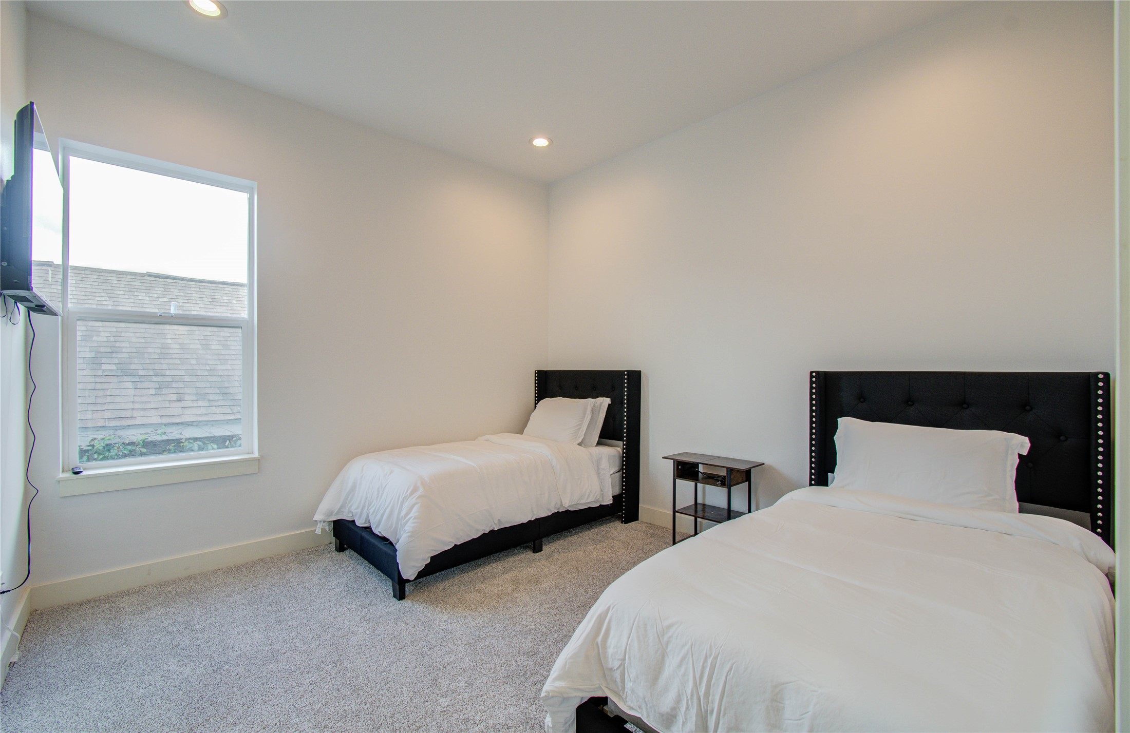 4311 Marina Street Houston, TX 77007 - Photo 34 of 42 a bedroom with two beds and a window