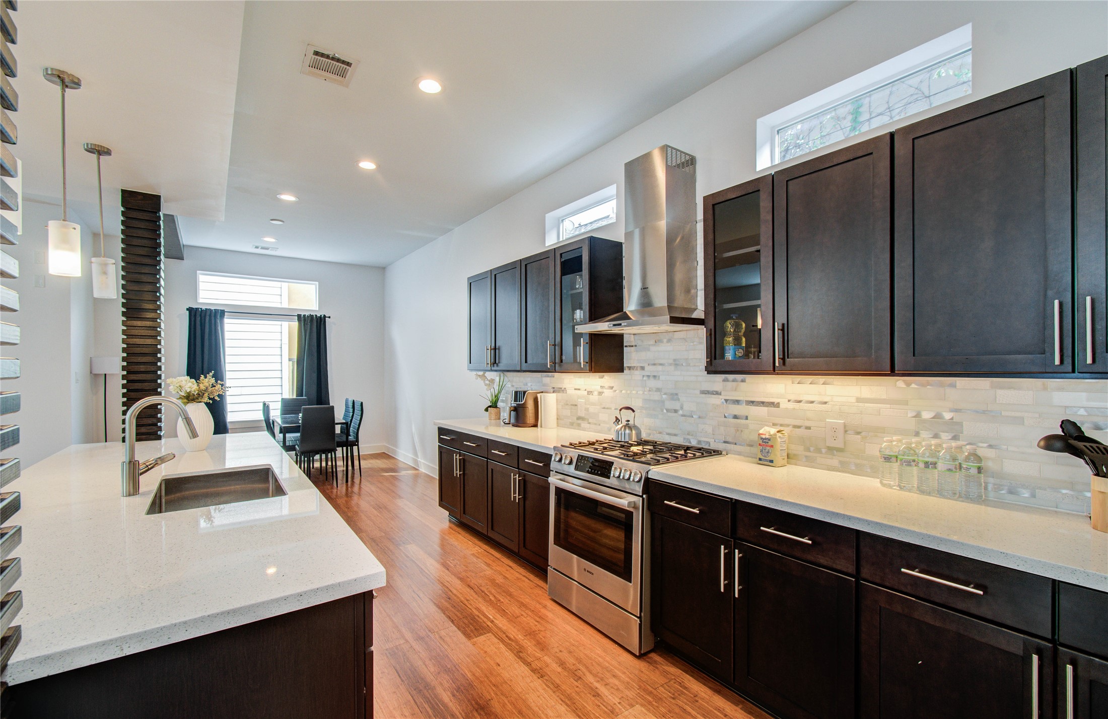 4311 Marina Street Houston, TX 77007 - Photo 40 of 42 a kitchen with stainless steel appliances granite countertop a sink stove and cabinets