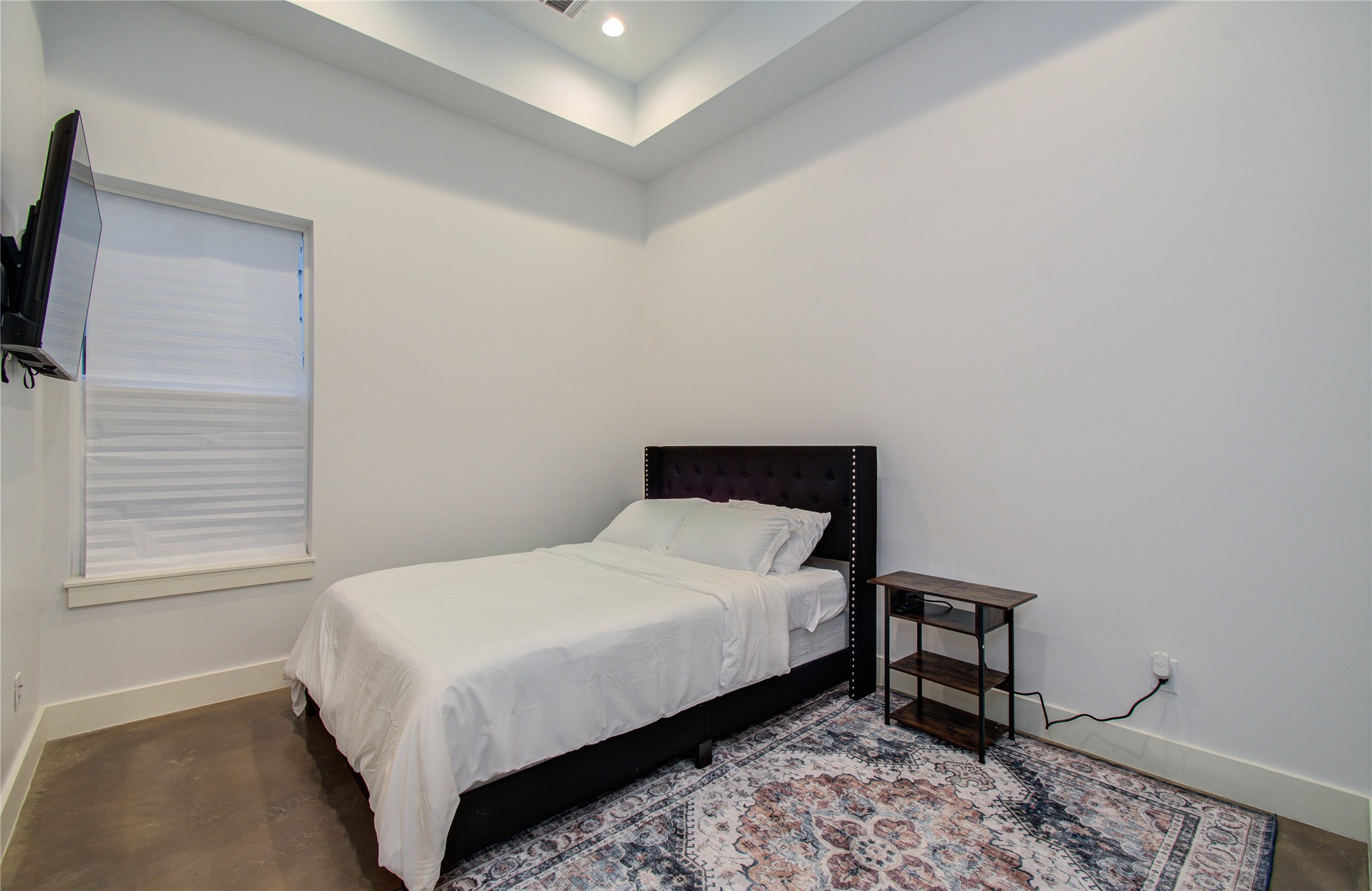 4311 Marina Street Houston, TX 77007 - Photo 8 of 42 a bedroom with a bed table and chair