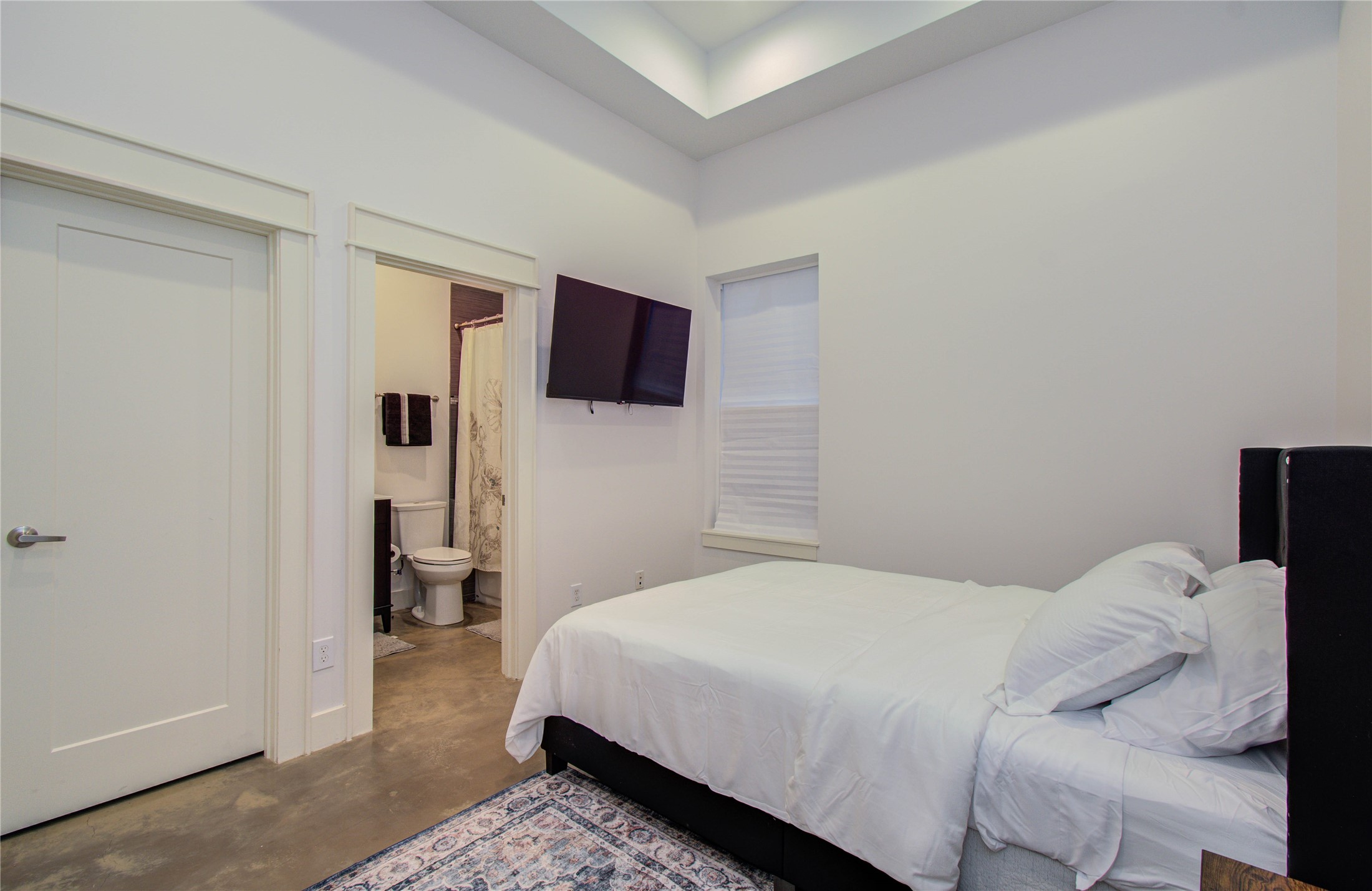 4311 Marina Street Houston, TX 77007 - Photo 9 of 42 a bedroom with a bed and flat screen tv