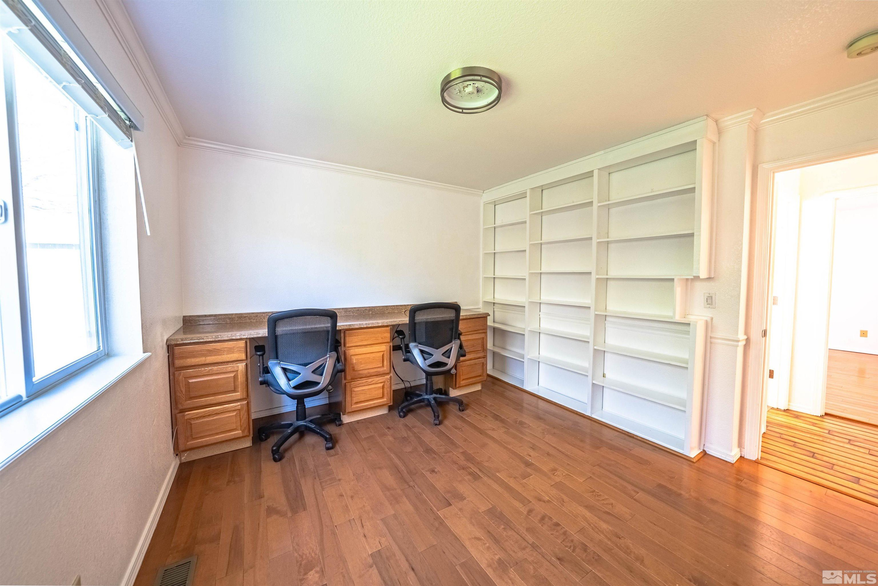 980 Ridgeview Drive Carson City, NV 89705 - Photo 10 of 18 a view of a workspace with furniture and a window