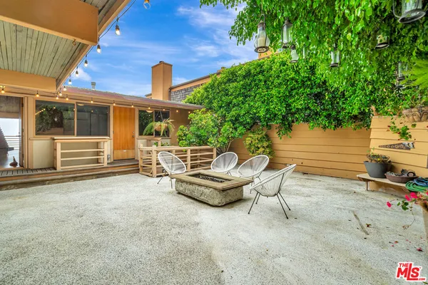 a kitchen with granite countertop a cabinets stainless steel appliances and a counter space