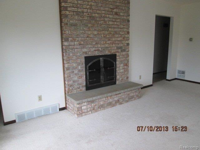 8052 Pinckney Road Pinckney, MI 48169 - Photo 18 of 36 BRICK FIREPLACE