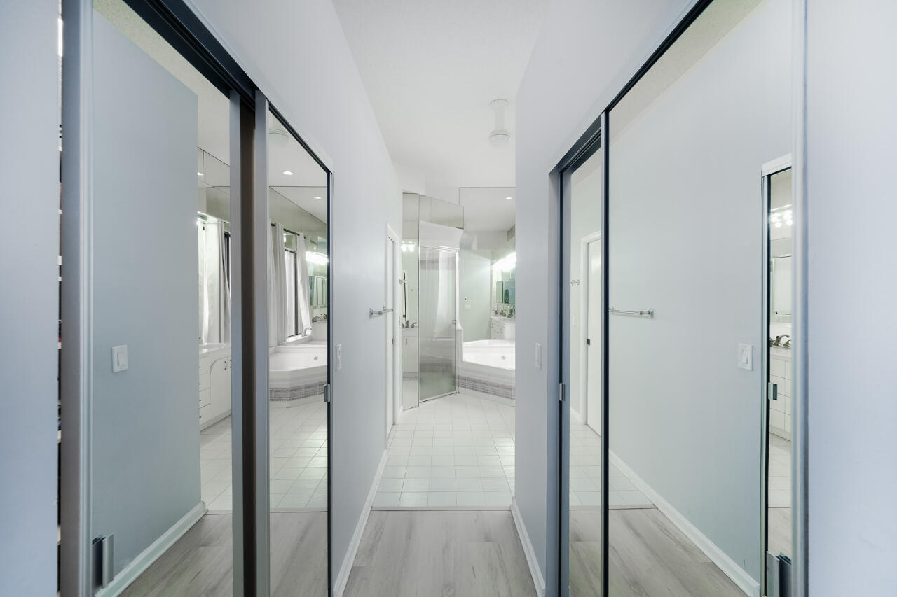 2412 Northwest 63rd Street Boca Raton, FL 33496 - Photo 21 of 53 a view of a bathroom from a hallway