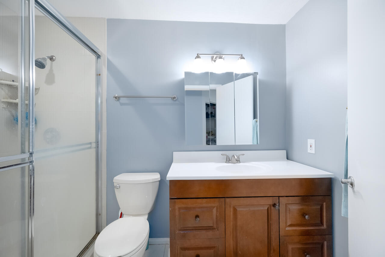 2412 Northwest 63rd Street Boca Raton, FL 33496 - Photo 36 of 53 a bathroom with a sink toilet and shower