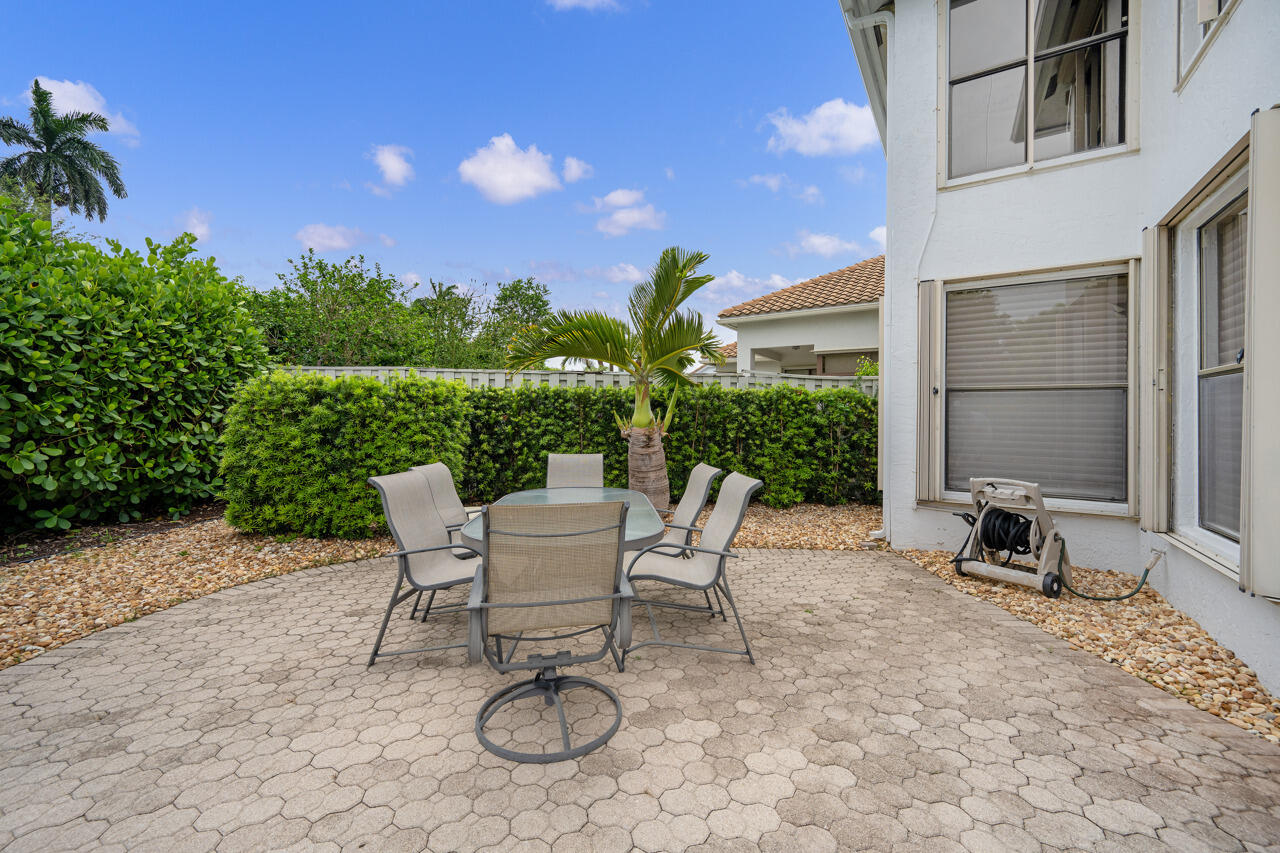 2412 Northwest 63rd Street Boca Raton, FL 33496 - Photo 38 of 53 a view of a chairs and table in patio