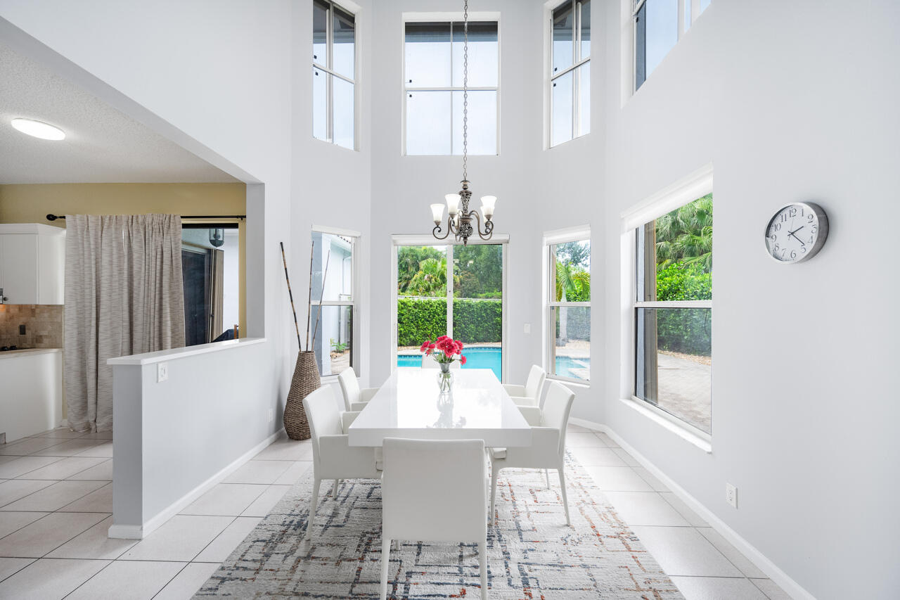 2412 Northwest 63rd Street Boca Raton, FL 33496 - Photo 10 of 53 a living room with large window