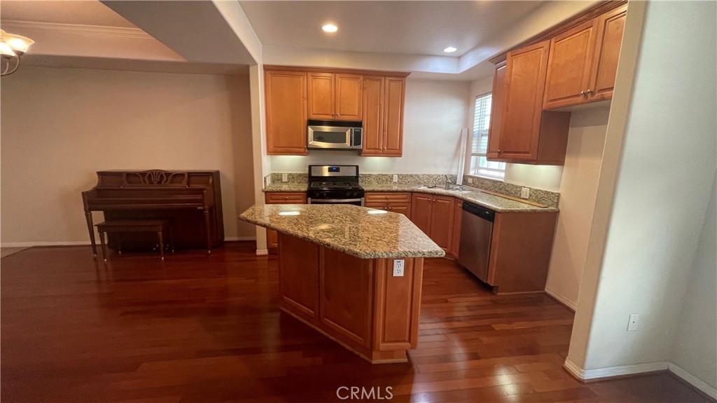 1425 Lomita Boulevard, Unit 3 Harbor City, CA 90710 - Photo 2 of 3 a kitchen with kitchen island granite countertop a sink a counter top space and appliances