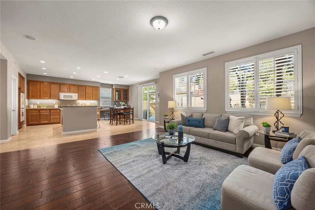 14280 Brant Court Eastvale, CA 92880 - Photo 14 of 47 a living room with furniture and a large window