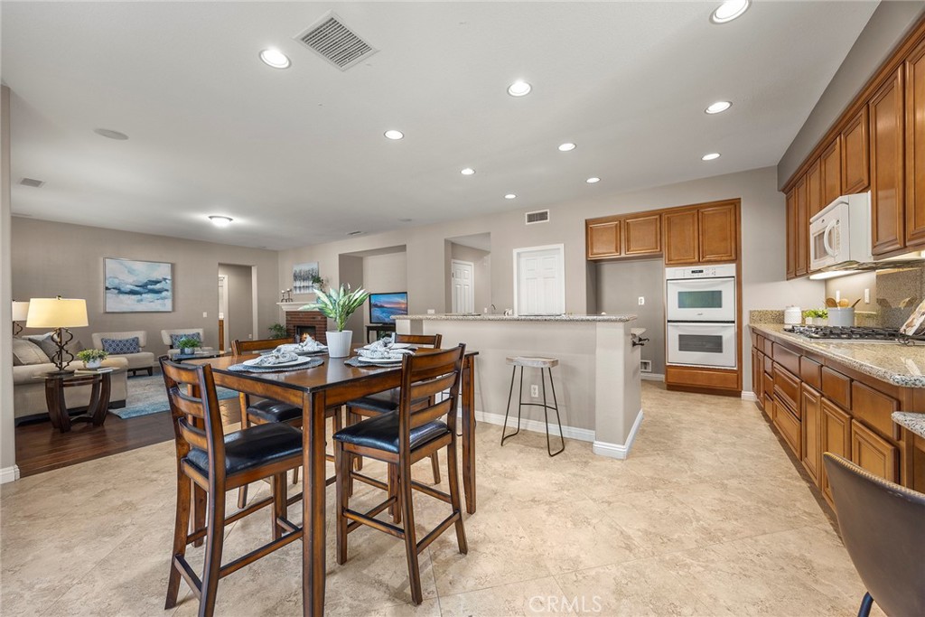 14280 Brant Court Eastvale, CA 92880 - Photo 18 of 47 a view of a dining room with furniture