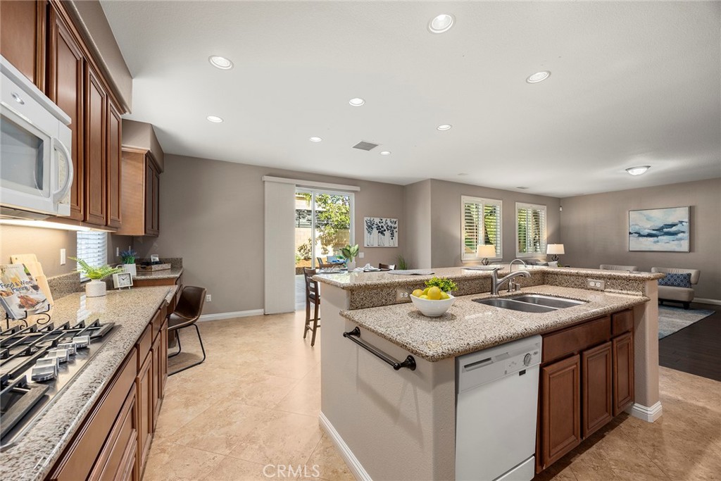 14280 Brant Court Eastvale, CA 92880 - Photo 21 of 47 a kitchen with a stove and a sink