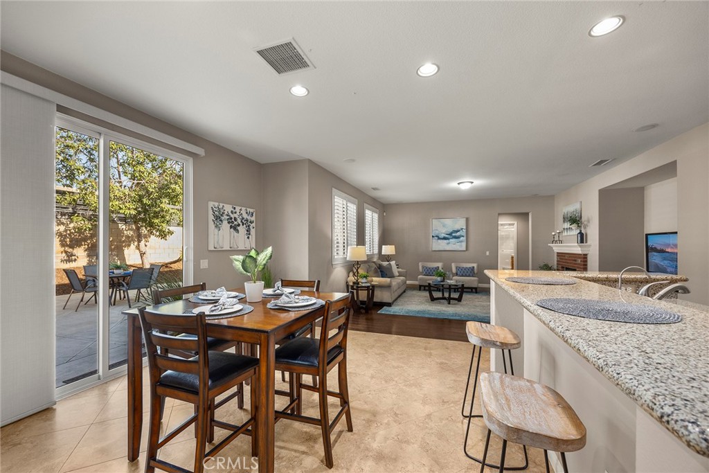 14280 Brant Court Eastvale, CA 92880 - Photo 22 of 47 a view of a dining room with furniture window and outside view