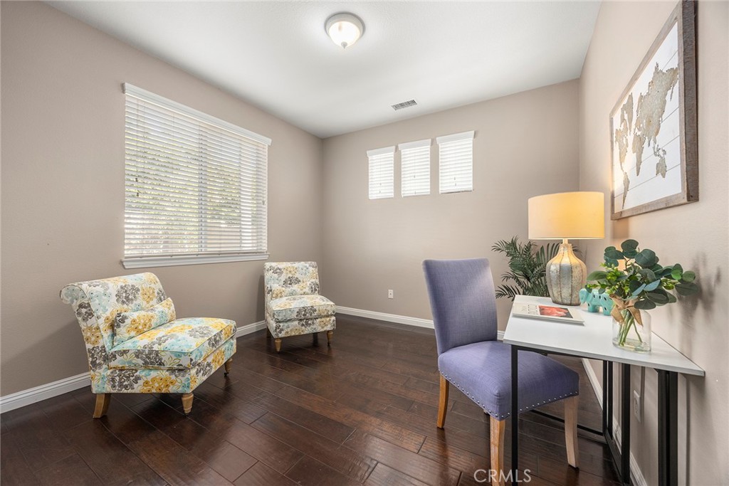 14280 Brant Court Eastvale, CA 92880 - Photo 23 of 47 a living room with furniture and a potted plant
