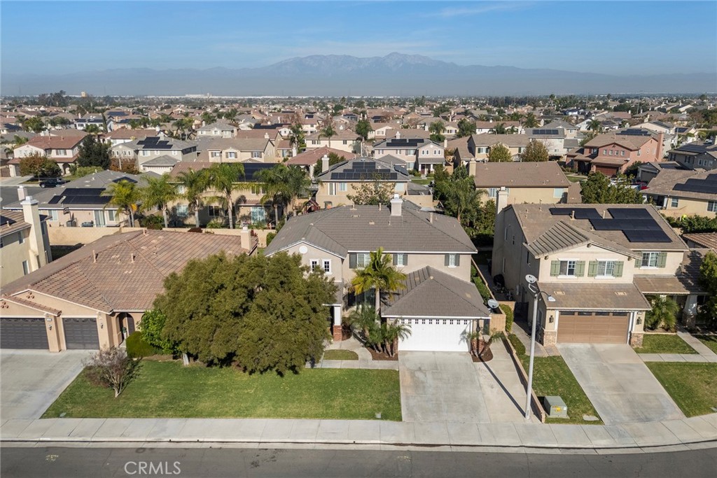 14280 Brant Court Eastvale, CA 92880 - Photo 3 of 47 an aerial view of residential houses with outdoor space