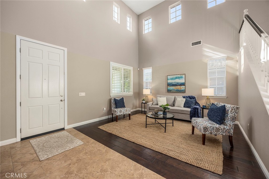 14280 Brant Court Eastvale, CA 92880 - Photo 6 of 47 a living room with furniture rug and window