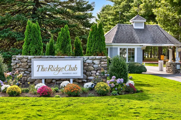 a view of sign board and garden
