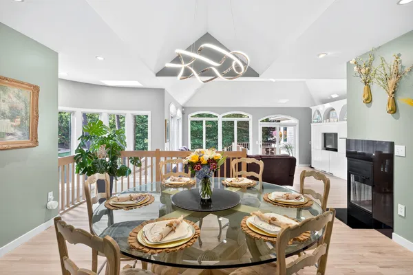 a view of a dining room with furniture and wooden floor