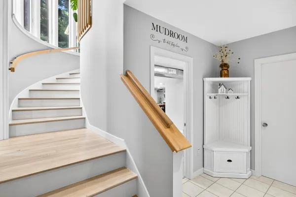 a spacious bathroom with a double vanity sink a mirror and a bathtub