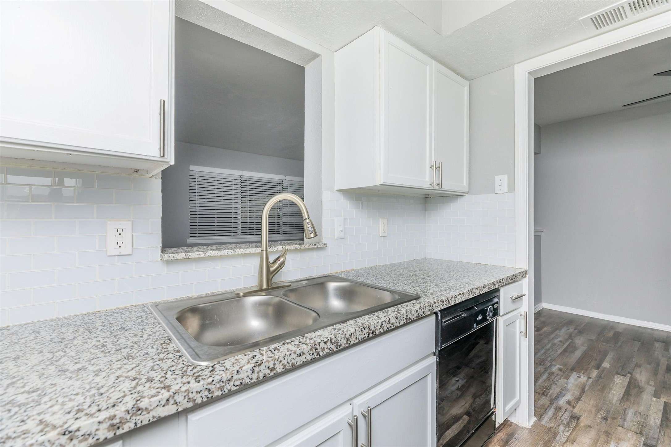 1212 Hampshire Lane, Unit 2111 Richardson, TX 75080 - Photo 15 of 40 a kitchen with granite countertop a sink and a stove