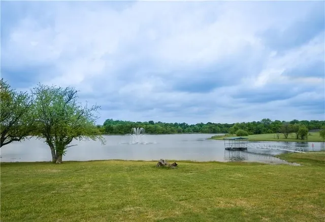 a view of a lake with houses in the back