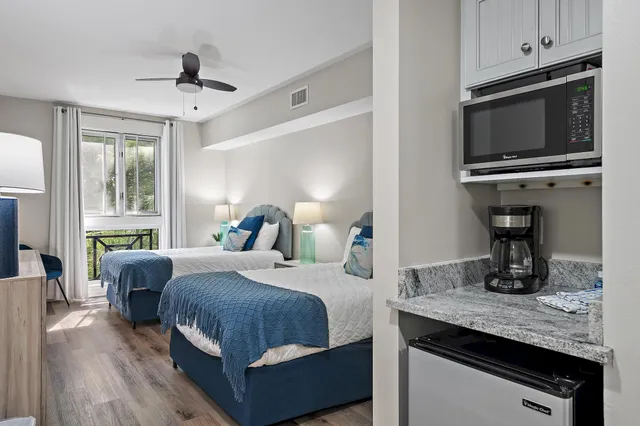 a bedroom with a bed and a television