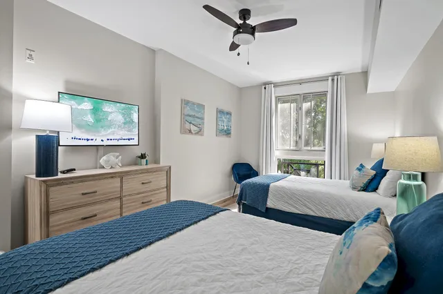 a bedroom with a large bed and a window