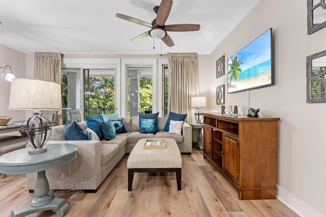 a living room with furniture a window and a table