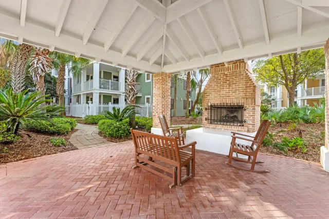 a view of a patio with a backyard table and chairs
