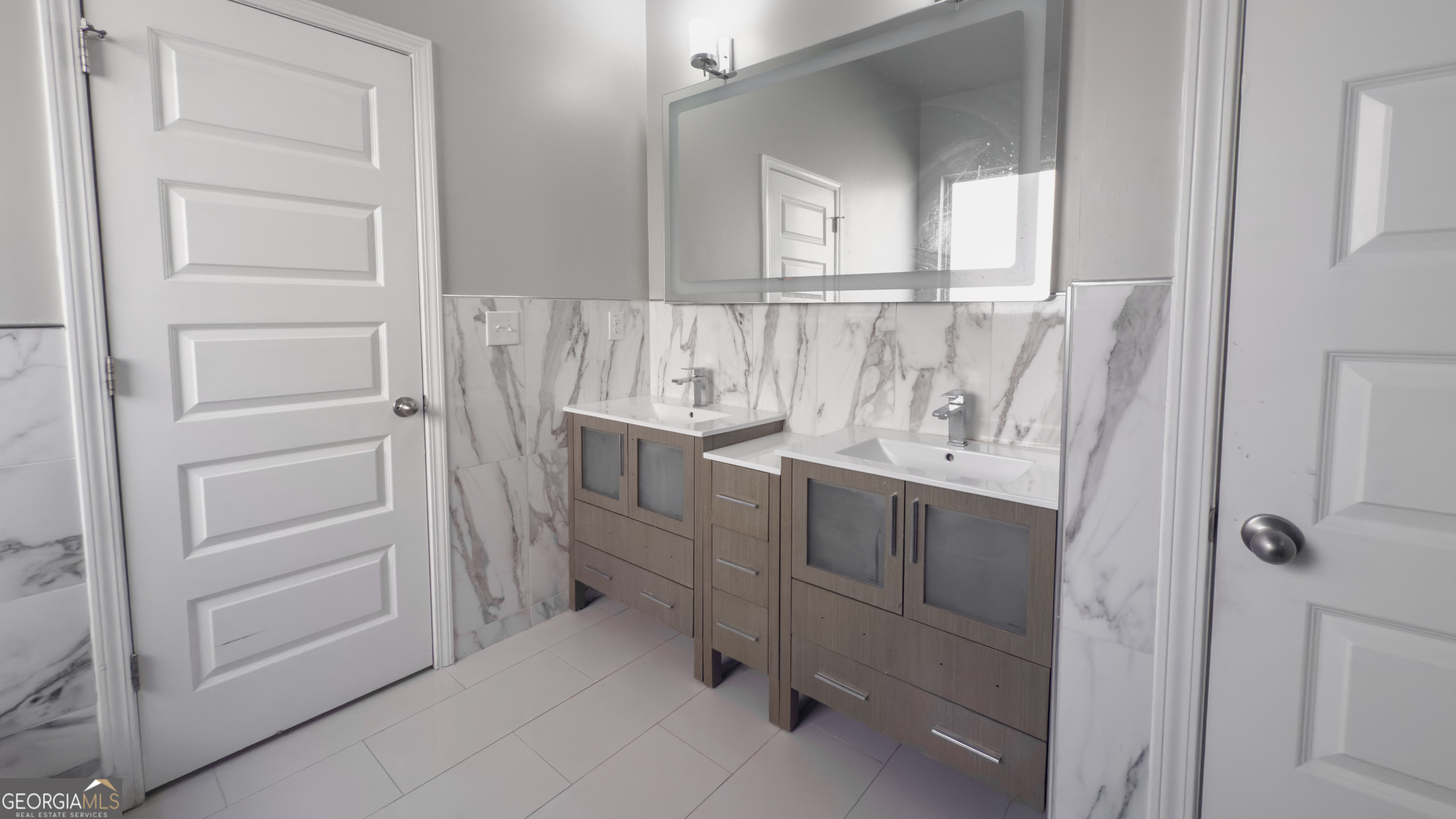 3368 Alhambra Circle Hampton, GA 30228 - Photo 16 of 43 a bathroom with a sink and mirror