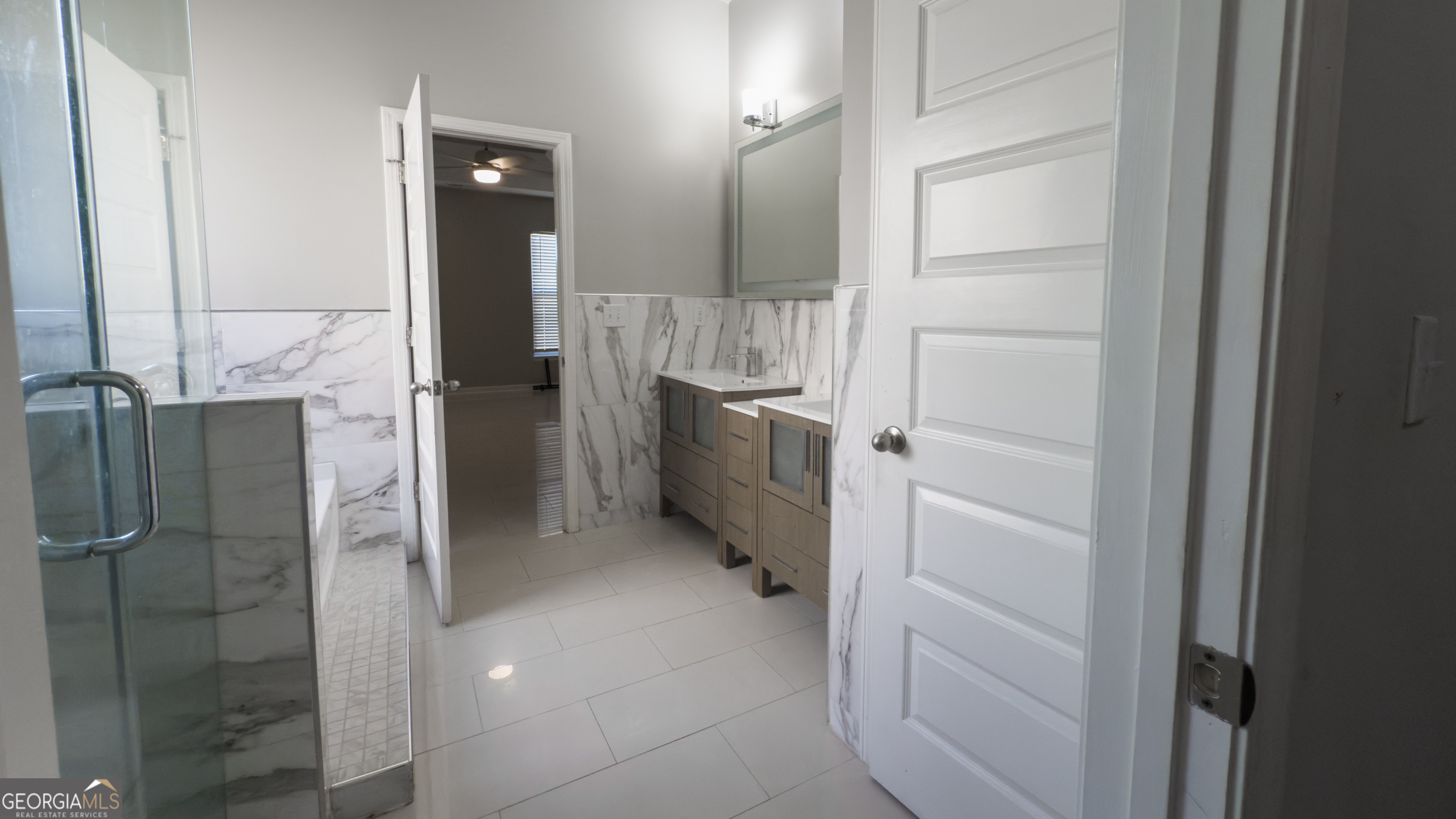 3368 Alhambra Circle Hampton, GA 30228 - Photo 17 of 43 a bathroom with a shower and a sink