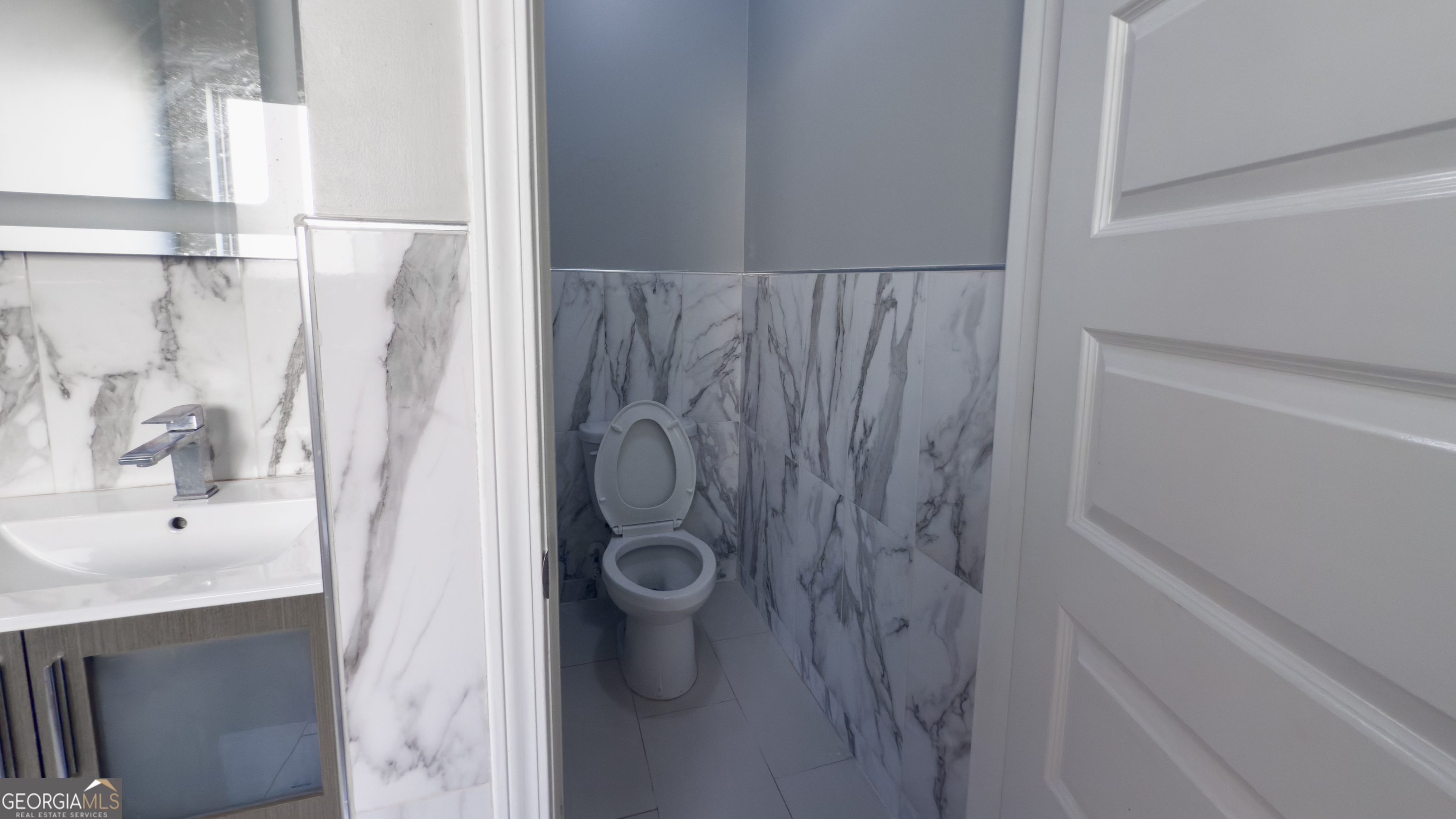 3368 Alhambra Circle Hampton, GA 30228 - Photo 19 of 43 a bathroom with a shower and a sink