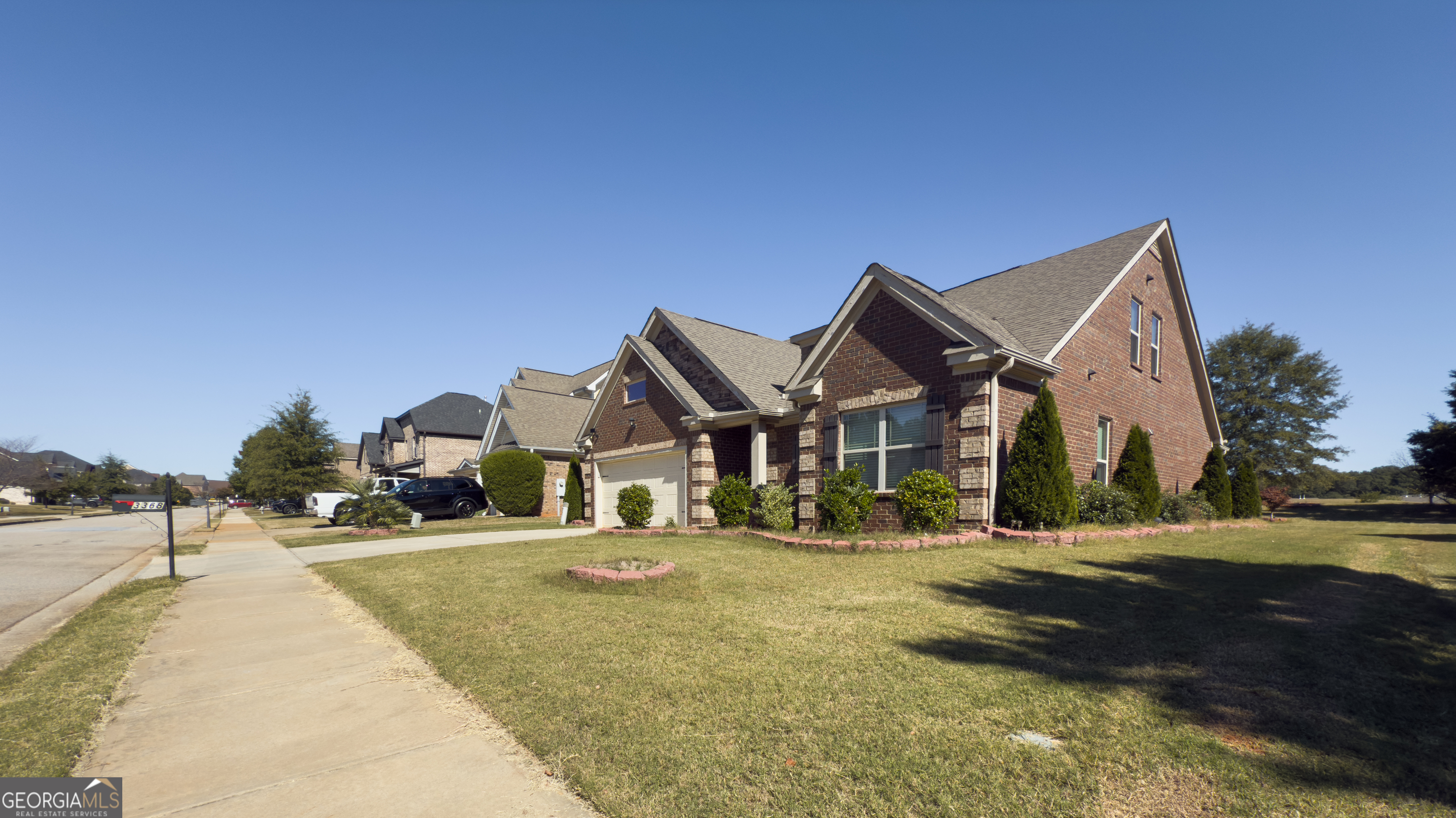 3368 Alhambra Circle Hampton, GA 30228 - Photo 2 of 43 a front view of a house with a yard
