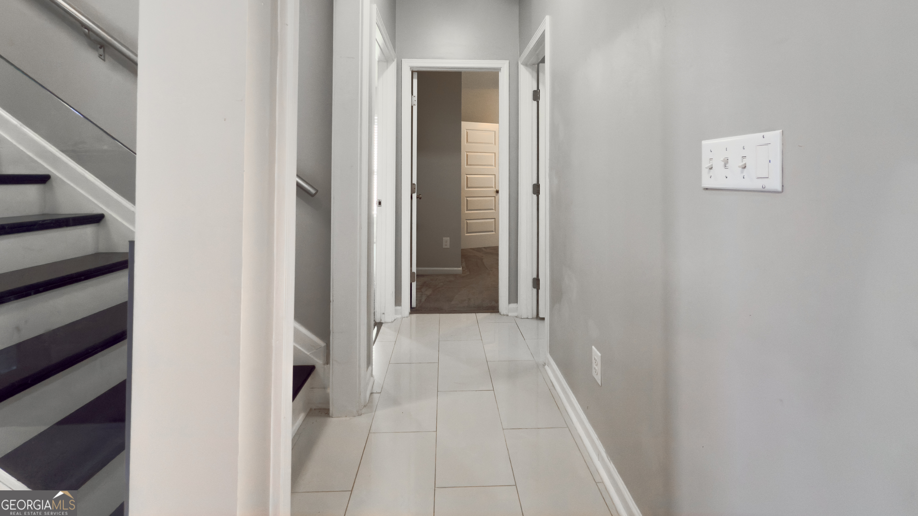 3368 Alhambra Circle Hampton, GA 30228 - Photo 22 of 43 a view of a hallway with wooden floor and entryway