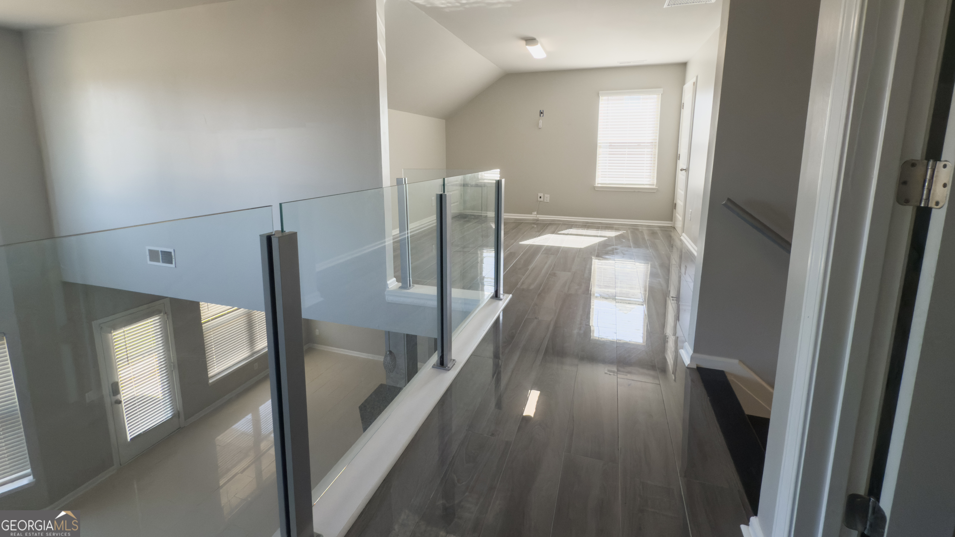 3368 Alhambra Circle Hampton, GA 30228 - Photo 30 of 43 a view of entryway and hall with wooden floor
