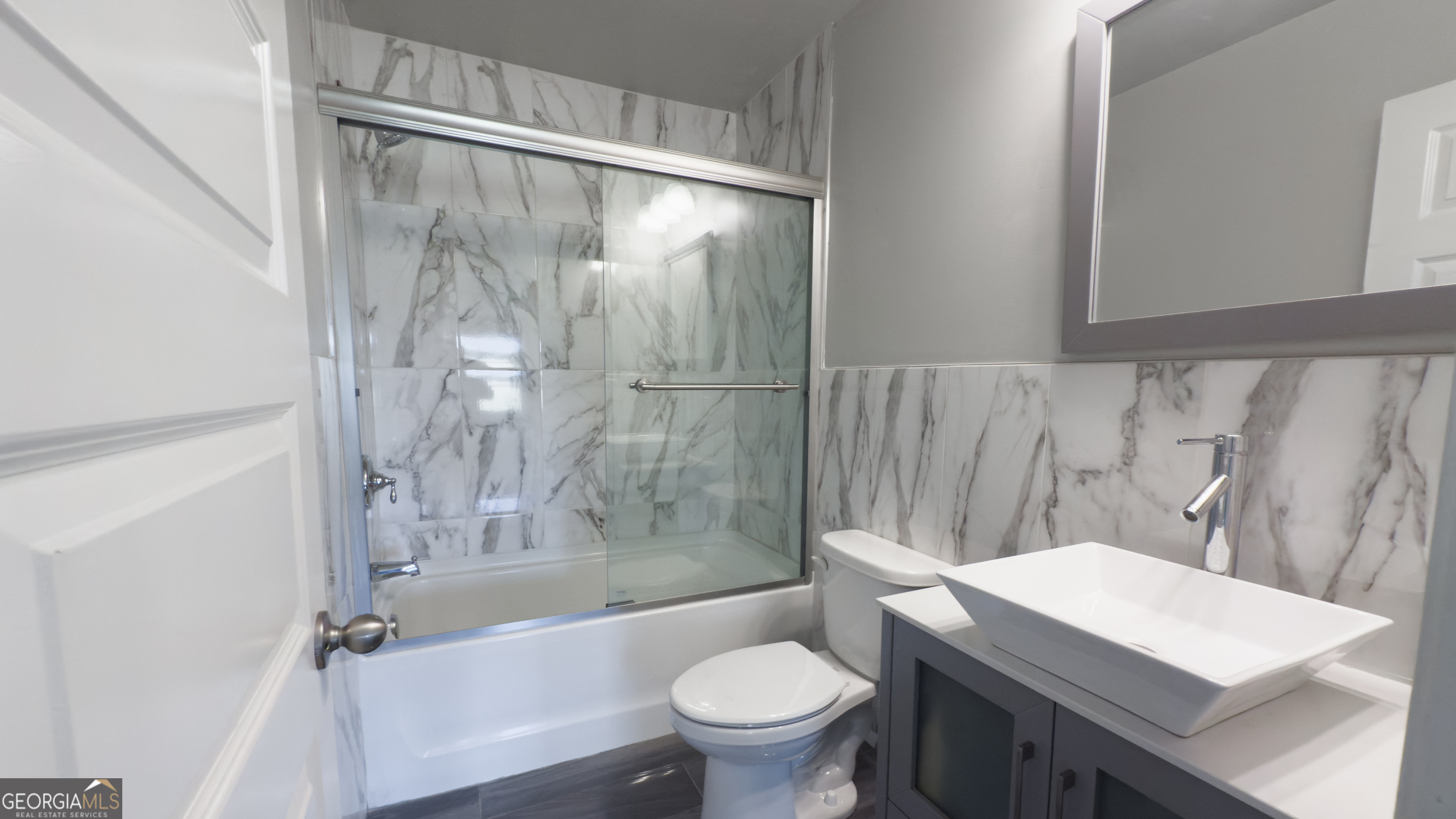 3368 Alhambra Circle Hampton, GA 30228 - Photo 31 of 43 a bathroom with a sink toilet and shower