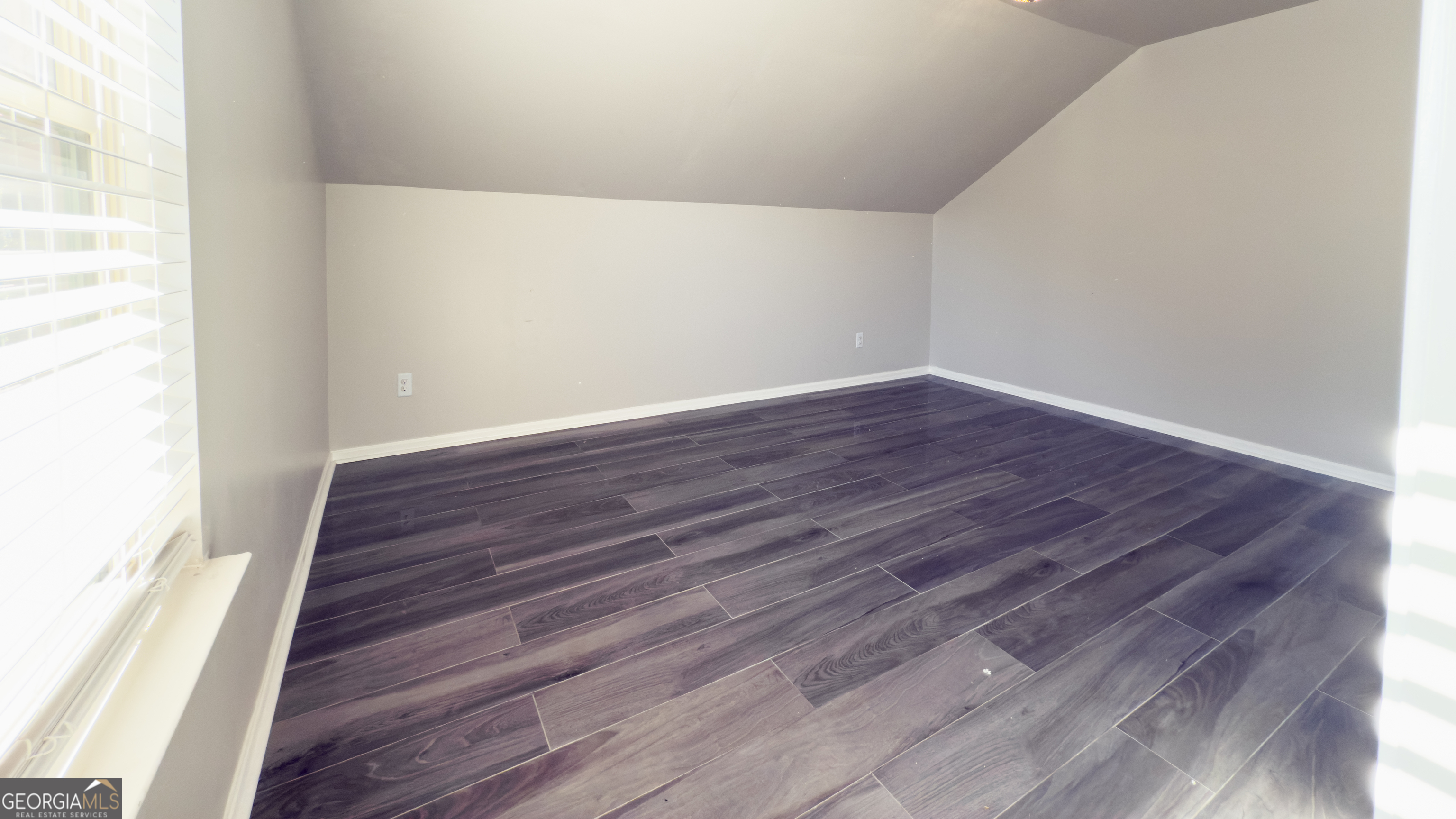 3368 Alhambra Circle Hampton, GA 30228 - Photo 34 of 43 a view of an empty room with wooden floor