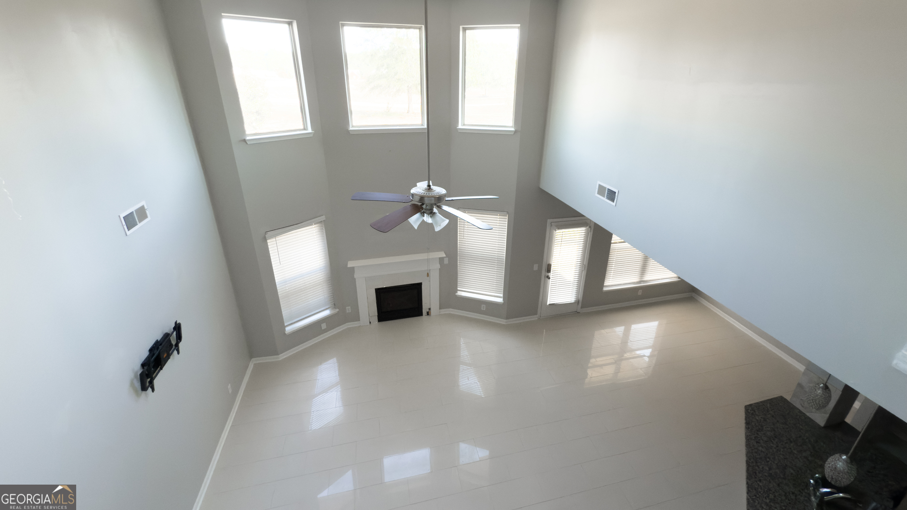 3368 Alhambra Circle Hampton, GA 30228 - Photo 35 of 43 a view of a livingroom with an empty space and a fireplace