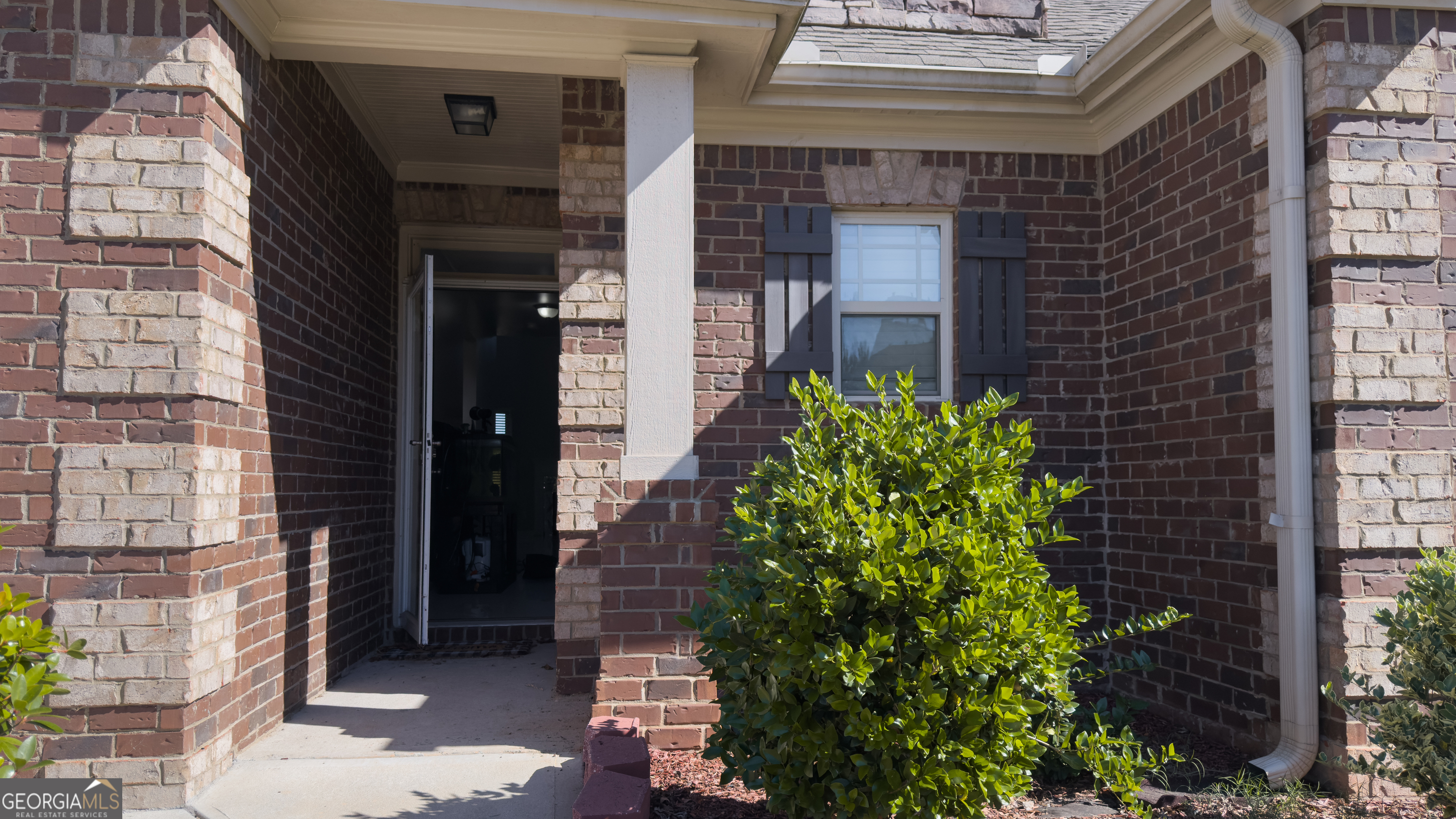 3368 Alhambra Circle Hampton, GA 30228 - Photo 5 of 43 a view of a brick house with a large windows