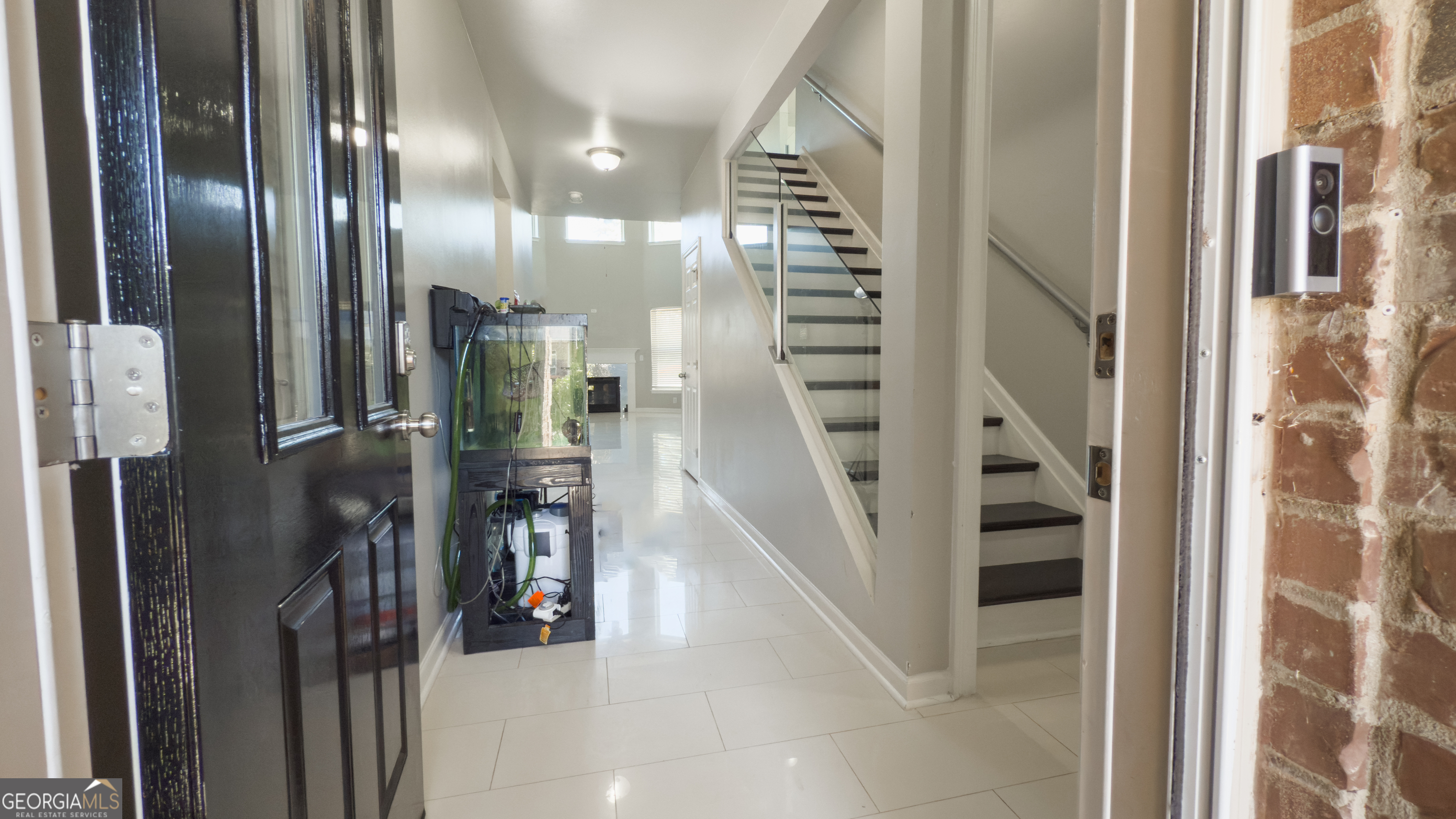 3368 Alhambra Circle Hampton, GA 30228 - Photo 6 of 43 a view of staircase with lots of frames on wall