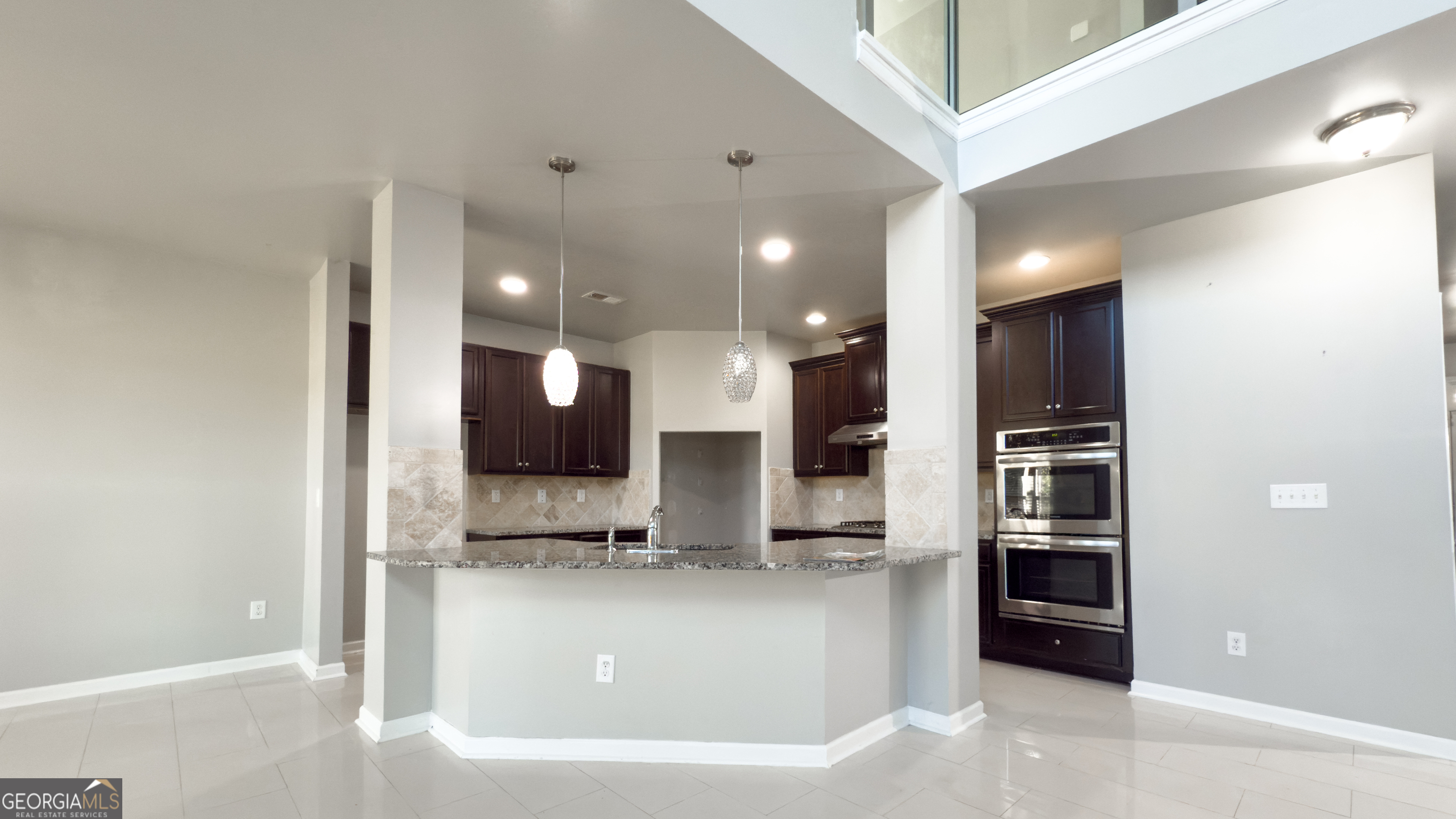 3368 Alhambra Circle Hampton, GA 30228 - Photo 7 of 43 a view of kitchen with stainless steel appliances kitchen island refrigerator sink and stove