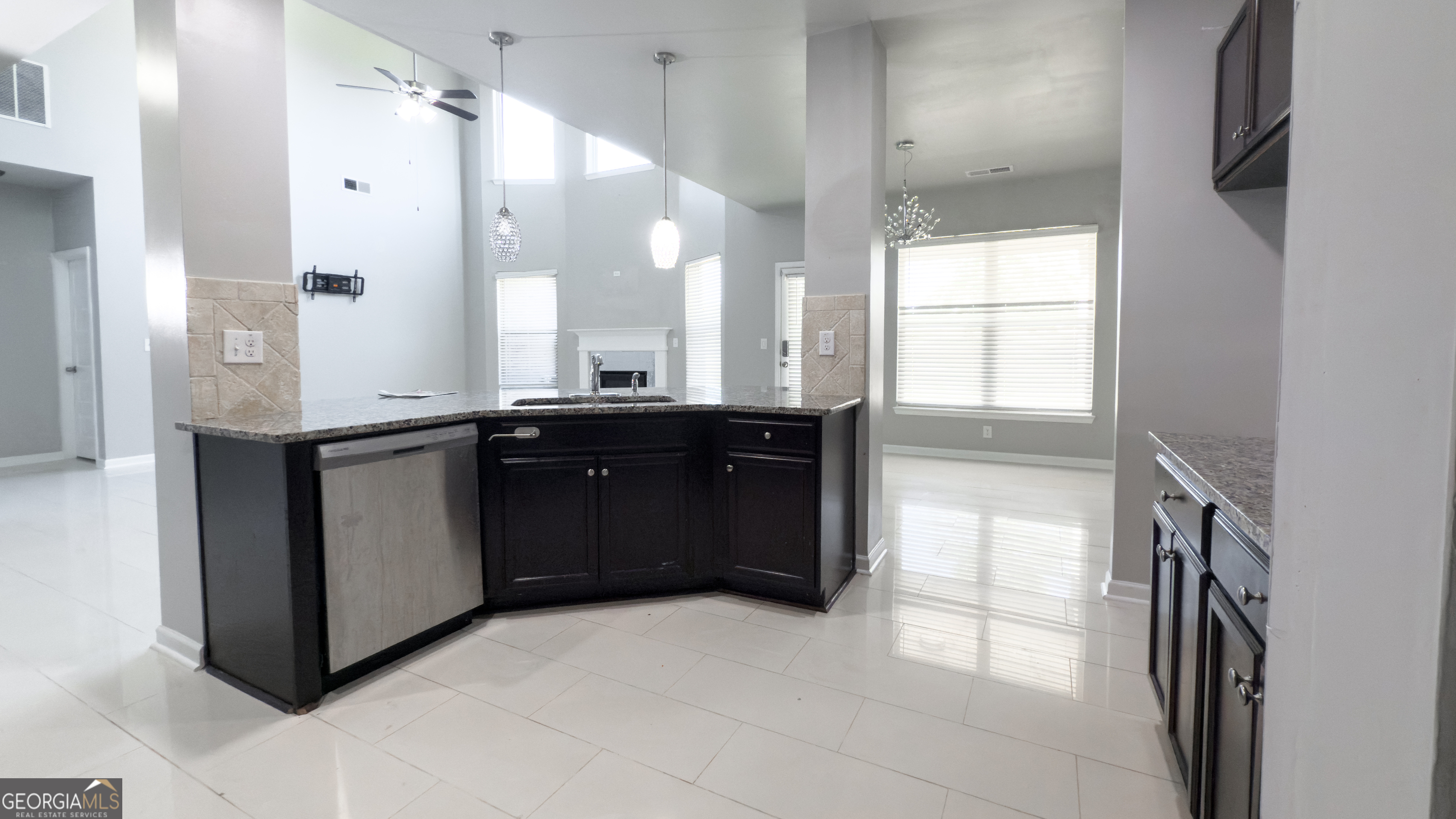 3368 Alhambra Circle Hampton, GA 30228 - Photo 9 of 43 a kitchen with a sink and a refrigerator