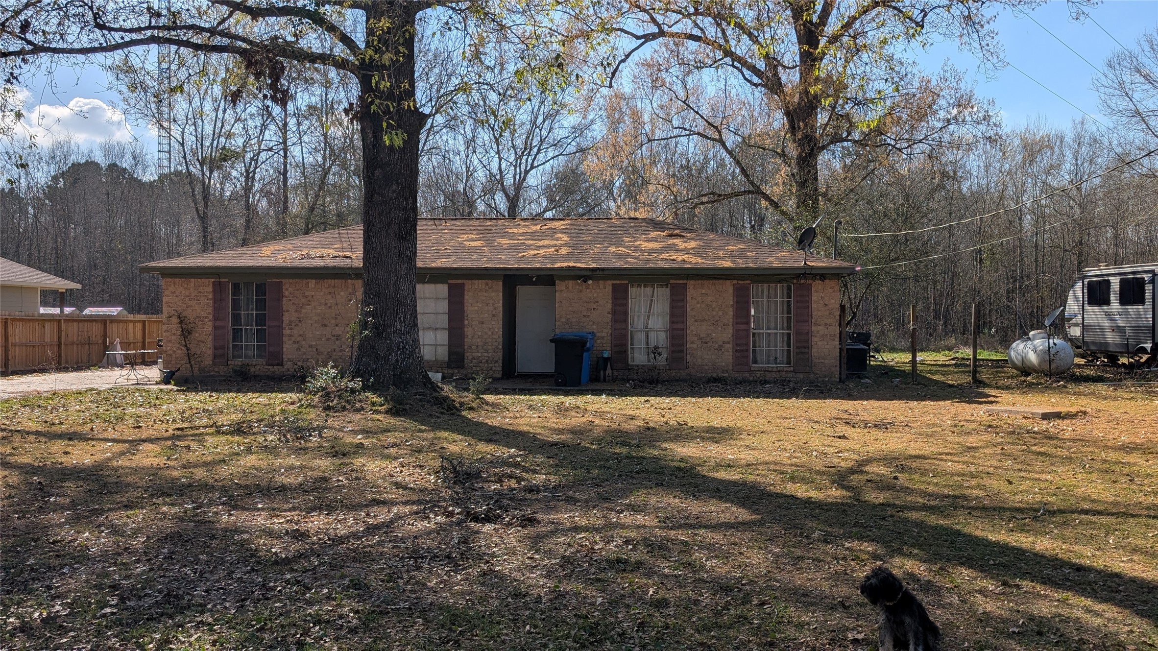 257 County Road 3669B Splendora, TX 77372 - Photo 13 of 14 a front view of a house with a yard and garage