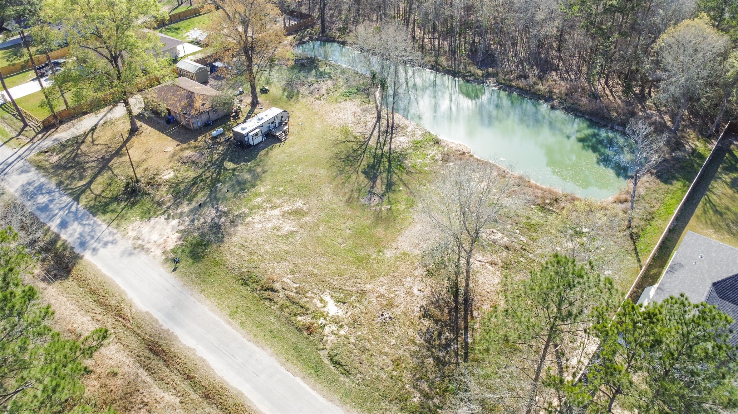 257 County Road 3669B Splendora, TX 77372 - Photo 3 of 14 a view of swimming pool from a lake view