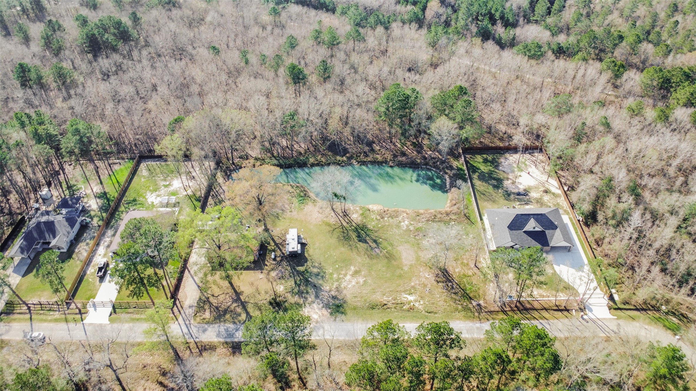 257 County Road 3669B Splendora, TX 77372 - Photo 6 of 14 an aerial view of residential houses with outdoor space