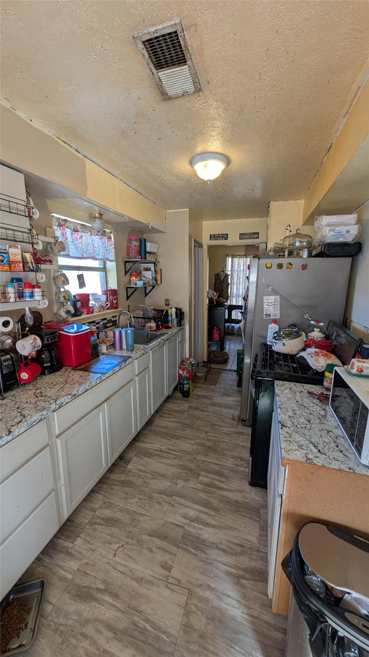 257 County Road 3669B Splendora, TX 77372 - Photo 8 of 14 a kitchen with lots of counter top space and furniture
