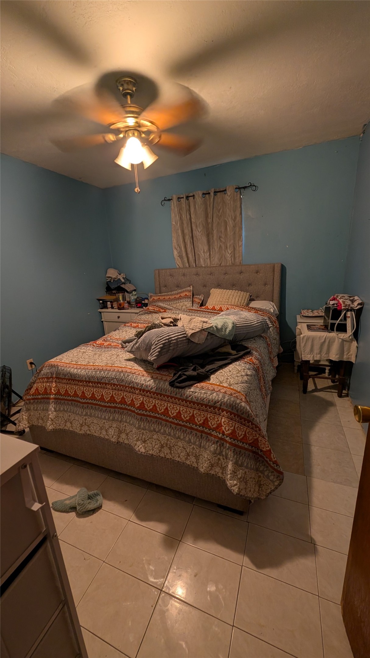 257 County Road 3669B Splendora, TX 77372 - Photo 10 of 14 a bedroom with a bed and chandelier