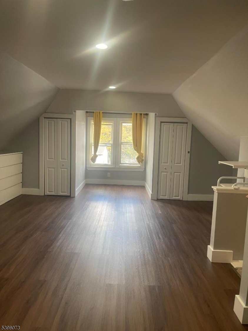 36 Augusta Street Irvington, NJ 07111 - Photo 11 of 15 an empty room with wooden floor and windows
